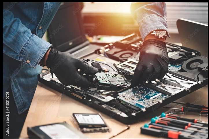 Technician performing precision laptop repair
